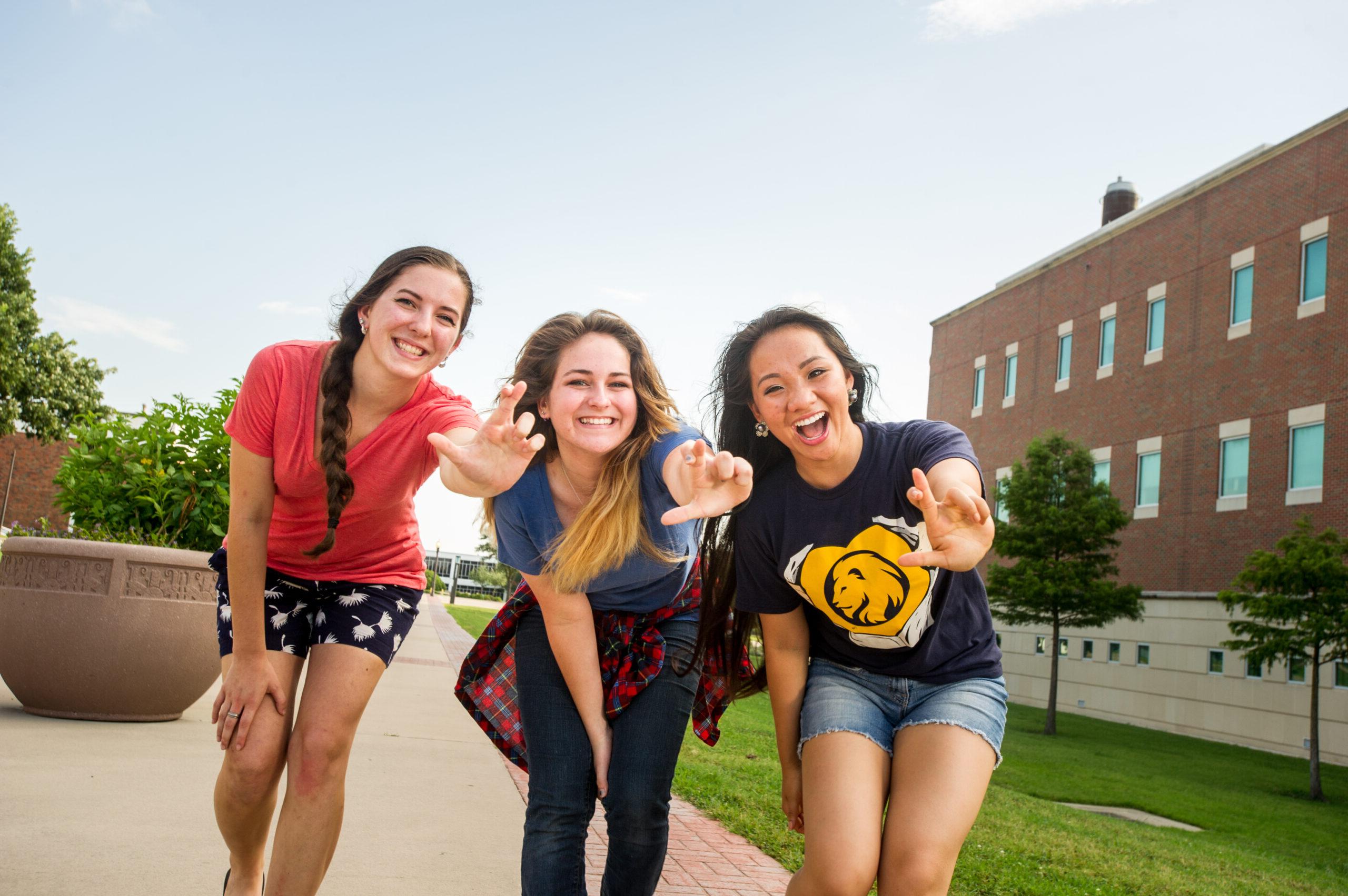 Three students outside of the Rayburn Student Center.